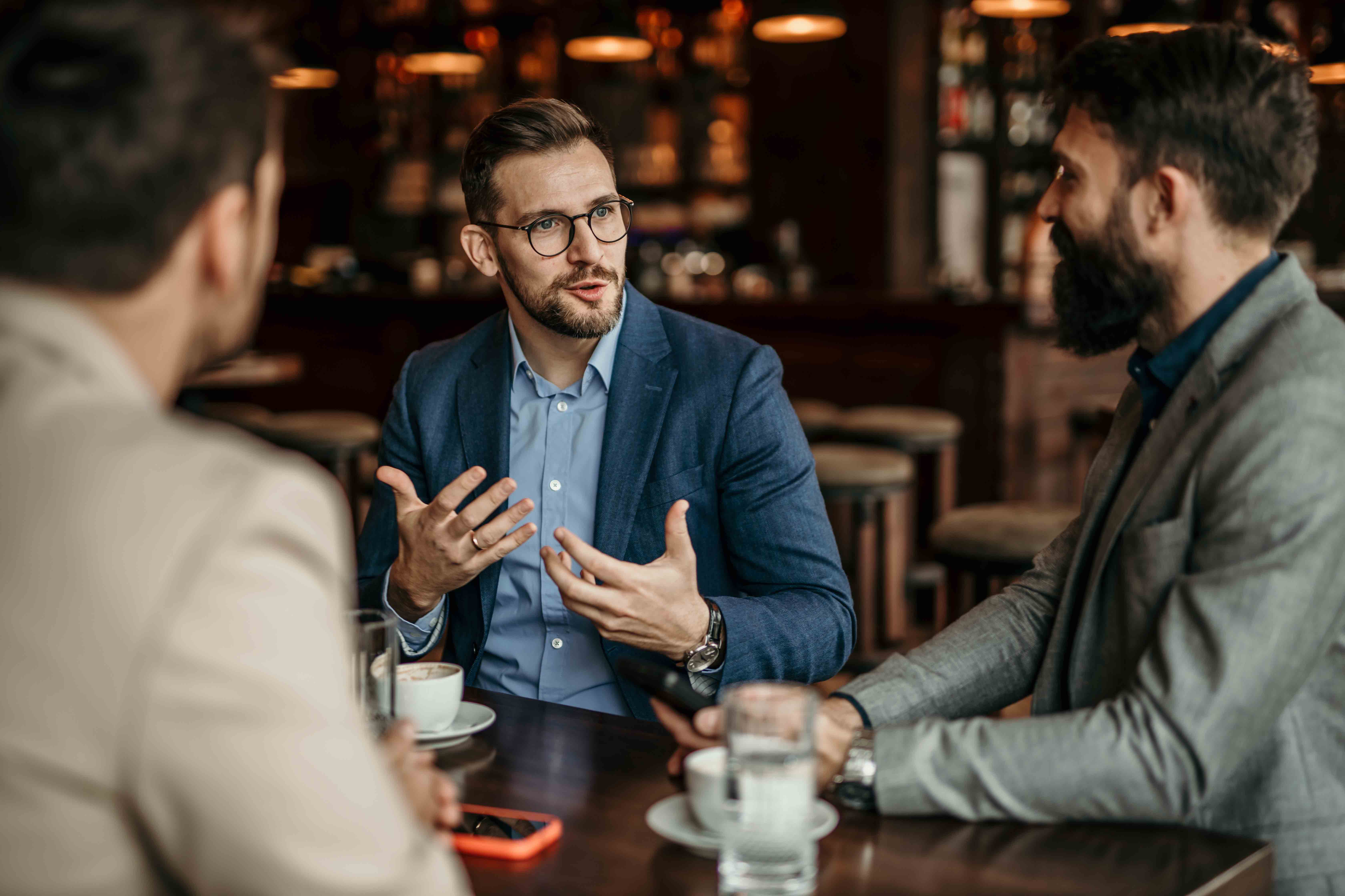 Business associates gather for coffee and discussion away from the office